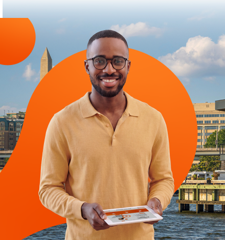 Washington renter holding a tablet in front of the DC skyline