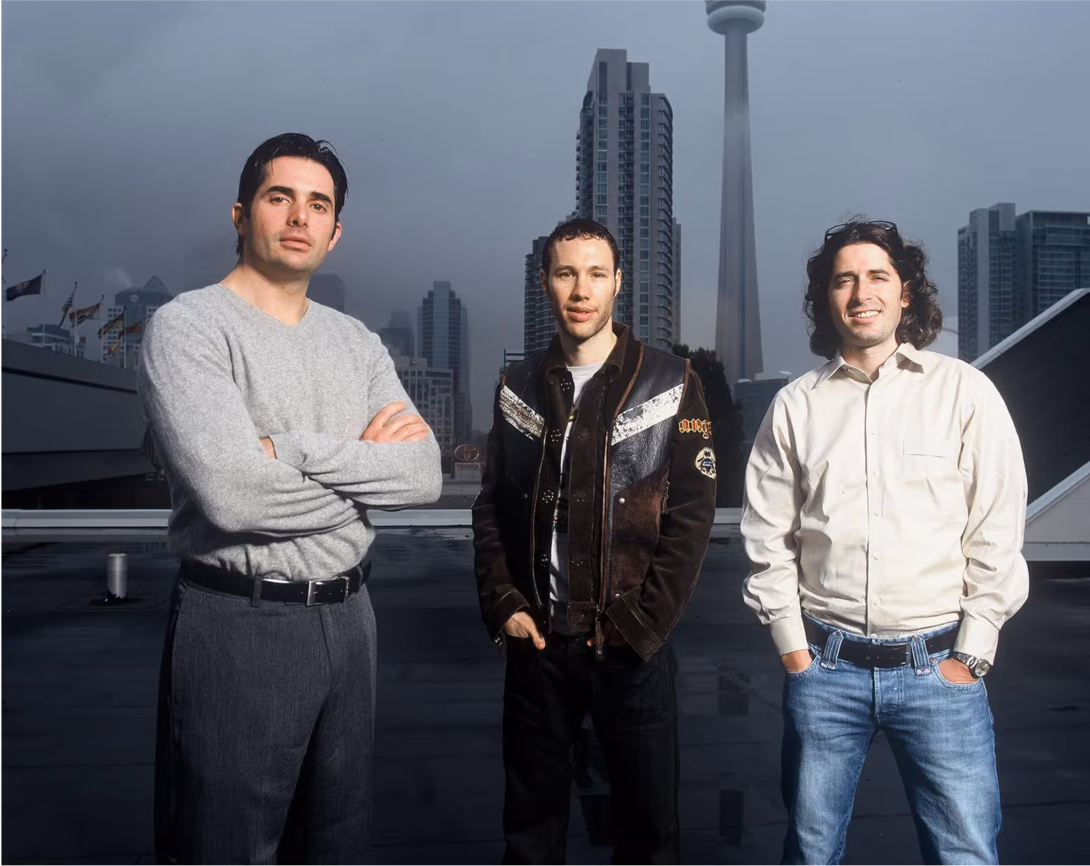 Ronnen Harary, Anton Rabie and Ben Varadi in toronto with the skyline and CN tower in the background.