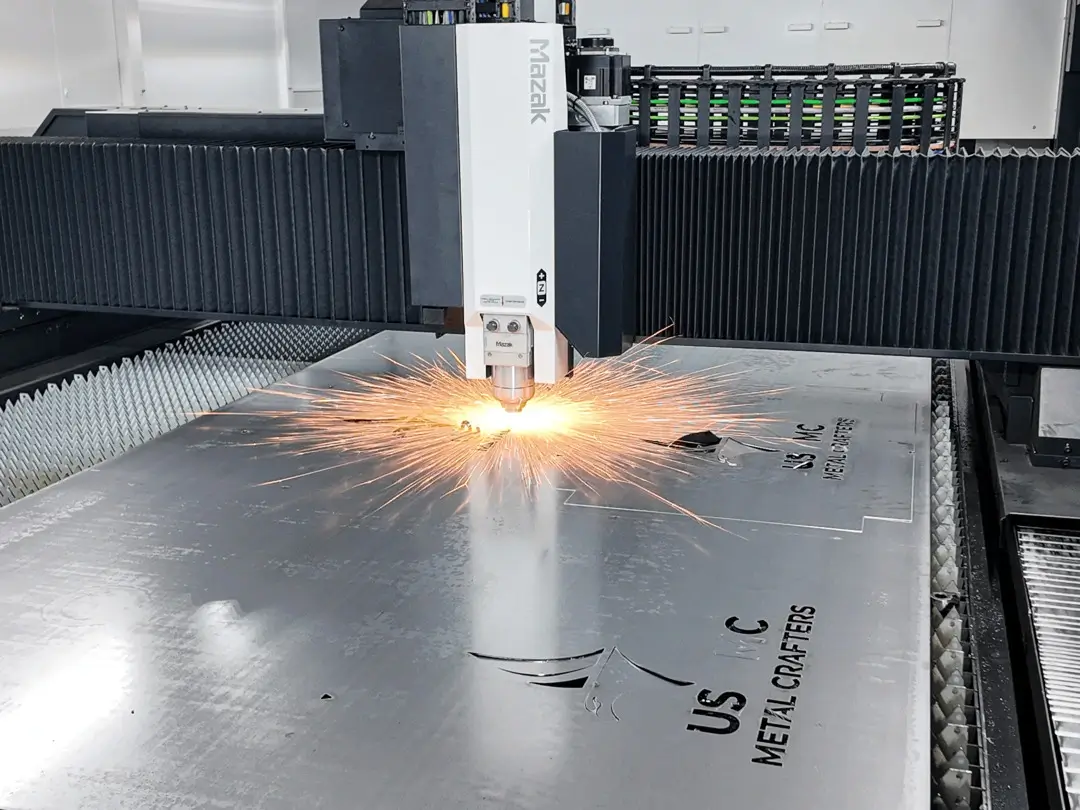 15K laser machine cutting a silver steel sign.