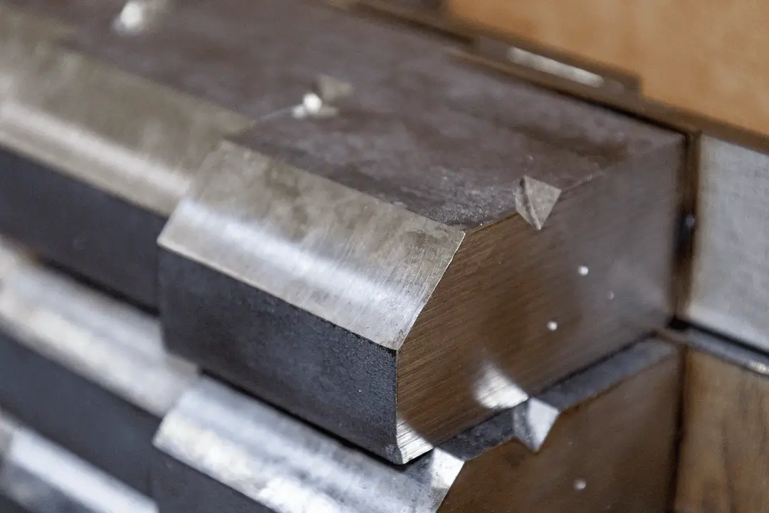 Close-up of a welded metal joint with a smooth, finished edge on a fabricated steel component.