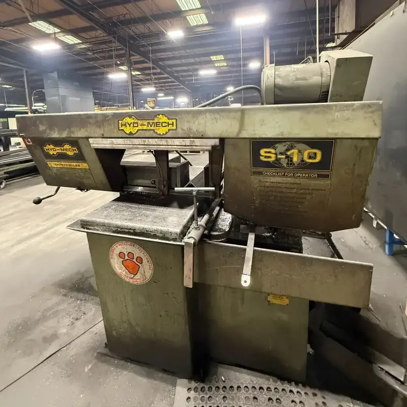 Hyd-Mech S-10 metal cutting bandsaw machine in an industrial workshop.