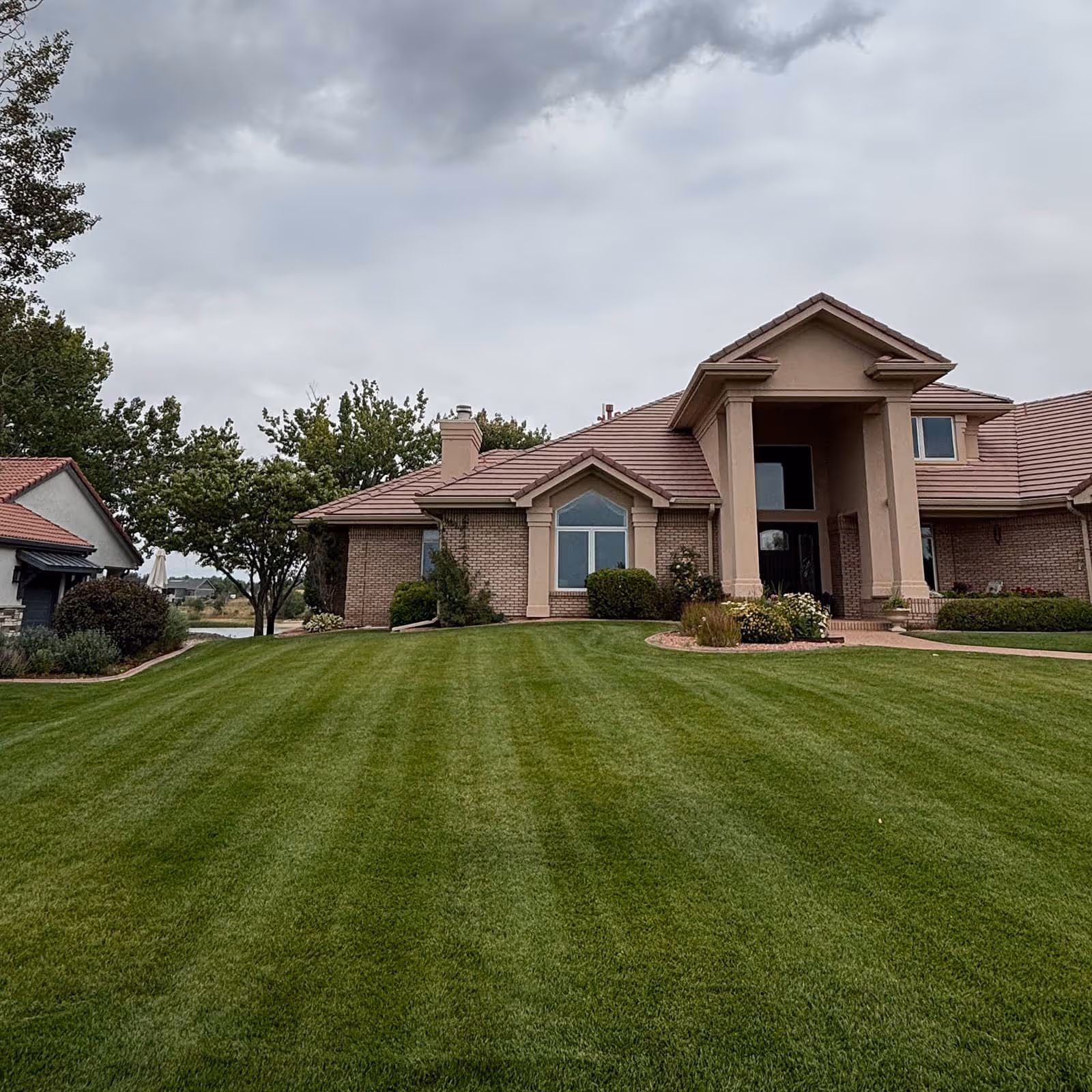 Beautifully maintained front yard in Fort Collins with clean edging and healthy grass