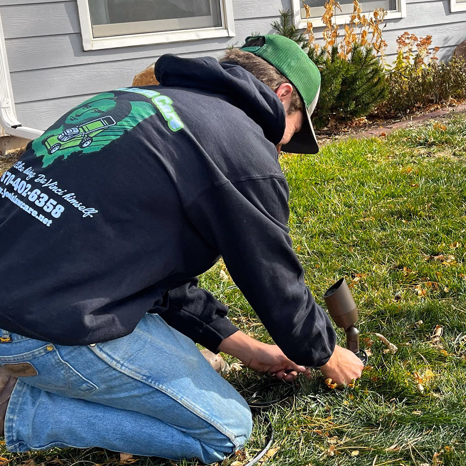 Outdoor landscape lighting illuminating walkway at night