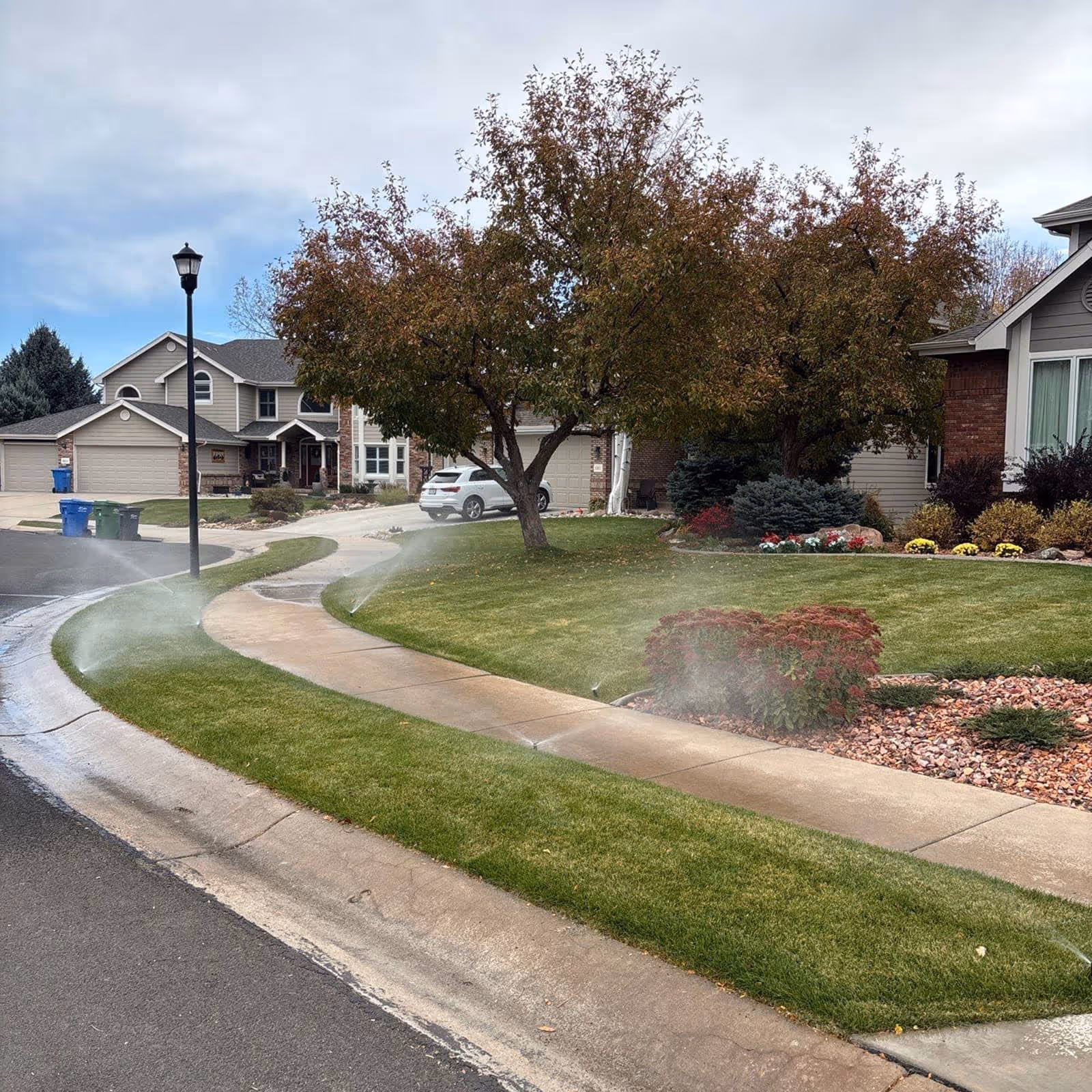 Sprinkler system watering lawn during irrigation cycle