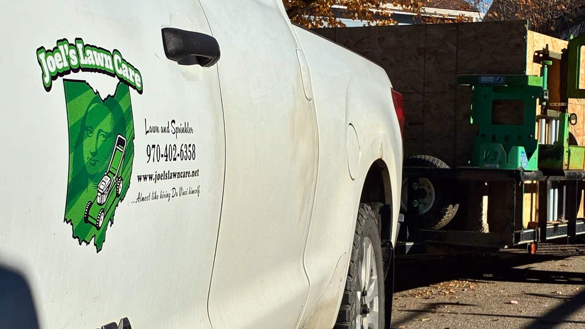 Joel’s Lawn Care logo on service truck