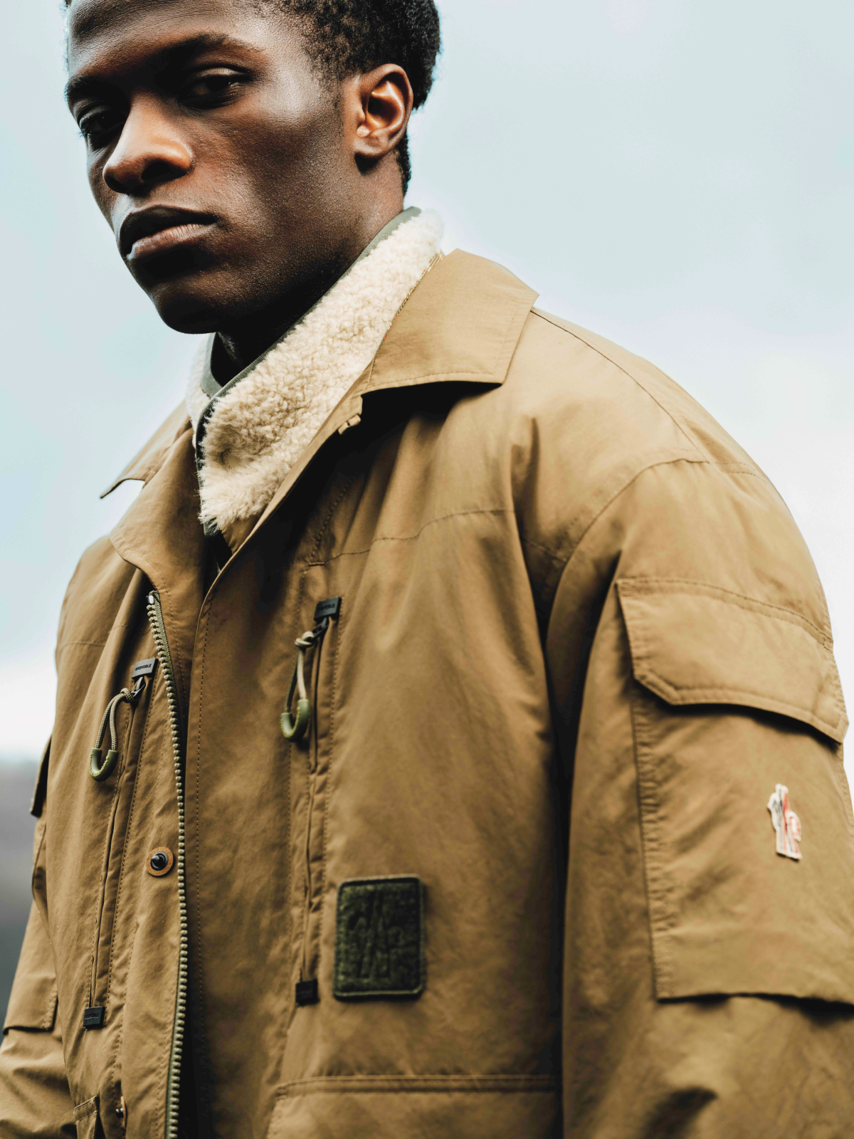 Fashion still from RESH Moncler Grenoble campaign –  wide frame with model in jacket