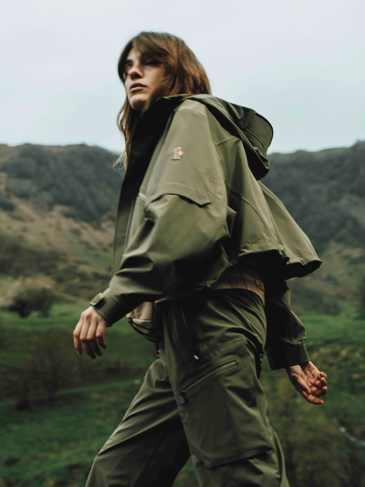Fashion still from RESH Moncler Grenoble campaign –  wide frame with model and green jacket 