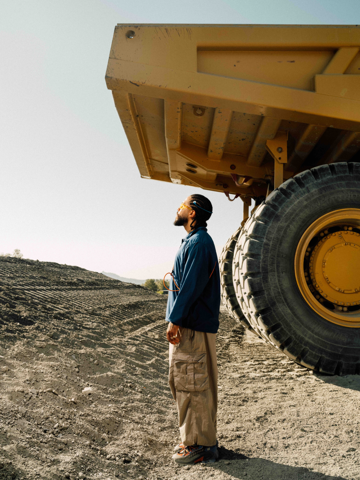 Cinematic still from RESH CAT Footwear commercial film — close-up portrait with  lighting