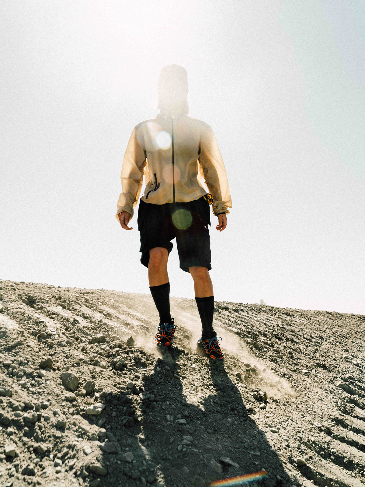 Cinematic still from RESH CAT Footwear commercial film — model with lighting