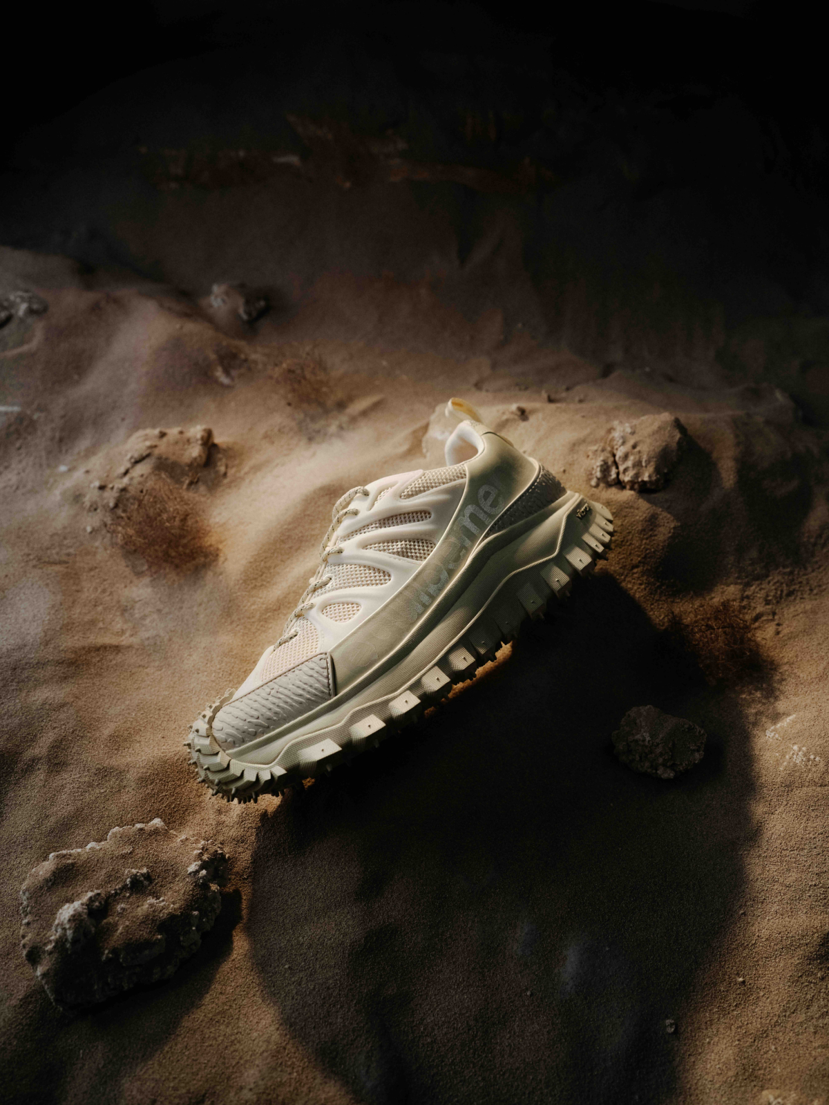 Cinematic still from RESH moncler campaign — wide frame with snickers 