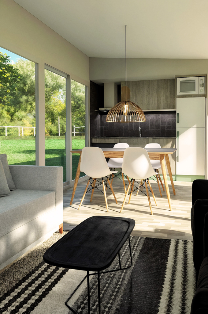 Modern dining area with a wooden table, white chairs, pendant light, and large windows overlooking green outdoor space.