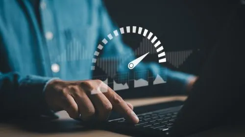 A person working on the laptop checking internet speed.