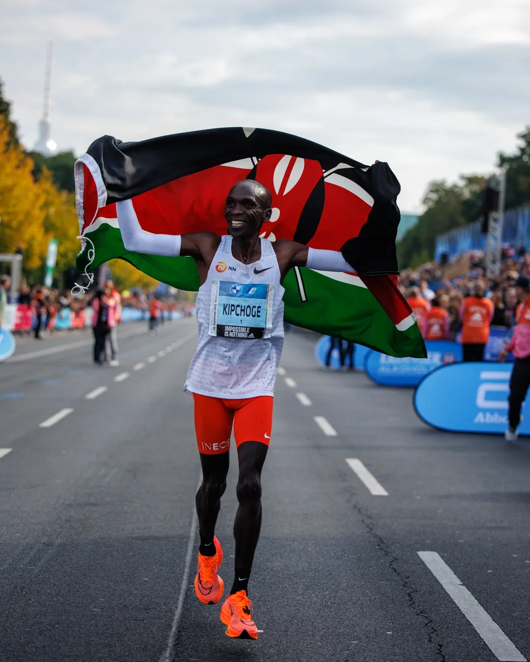 Eliud Kipchoge celebrating after setting a new world record at the 2022 Berlin Marathon.