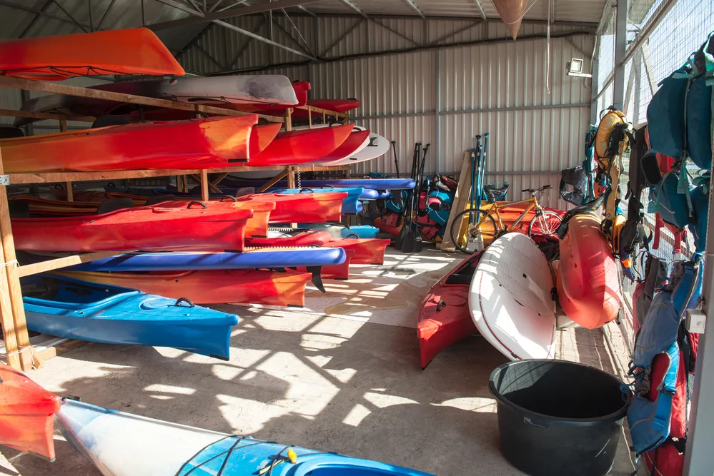 Multiple kayaks being stored in a storage 