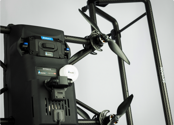 Close-up of Avestec SKYRON2  drone with dual propellers and a mounted sensor labeled EMAT.