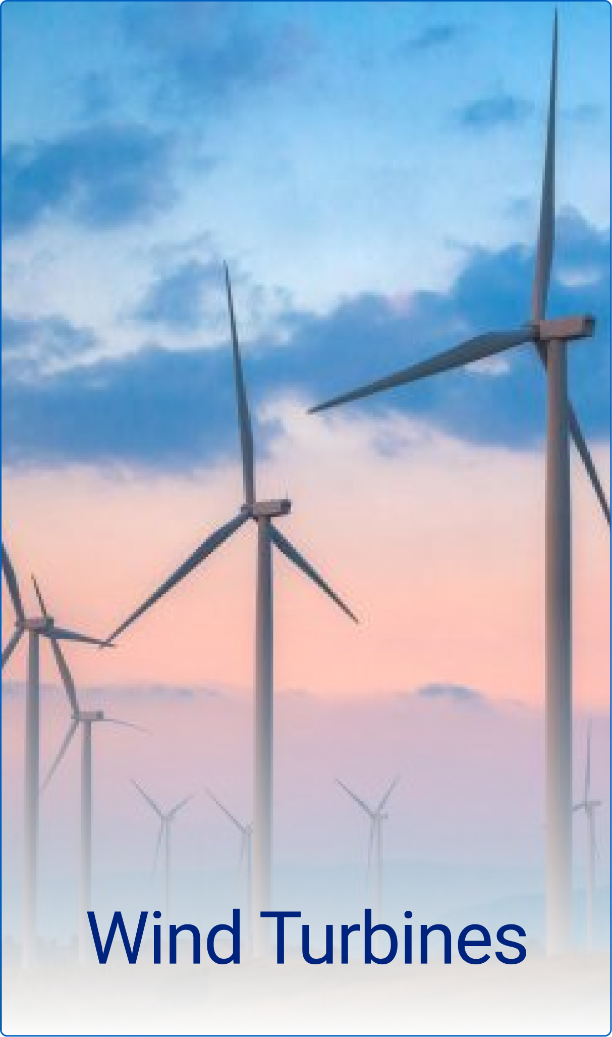 Multiple wind turbines standing tall against a pastel sky at sunset.