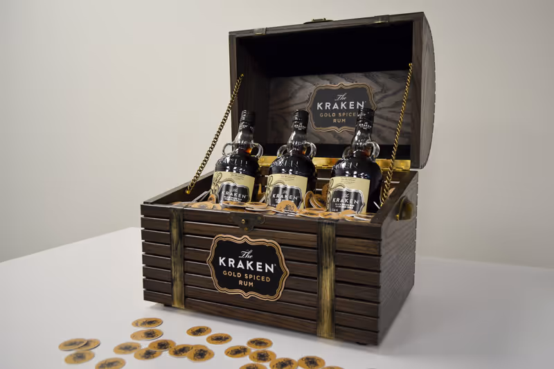 custom-build treasure chest for an experiential brand activation at a Toronto event. The chest is for a rum company and includes three inserts for bottles, and LED lighting from underneath. It also includes custom hardware and signage, along with laser-cut
