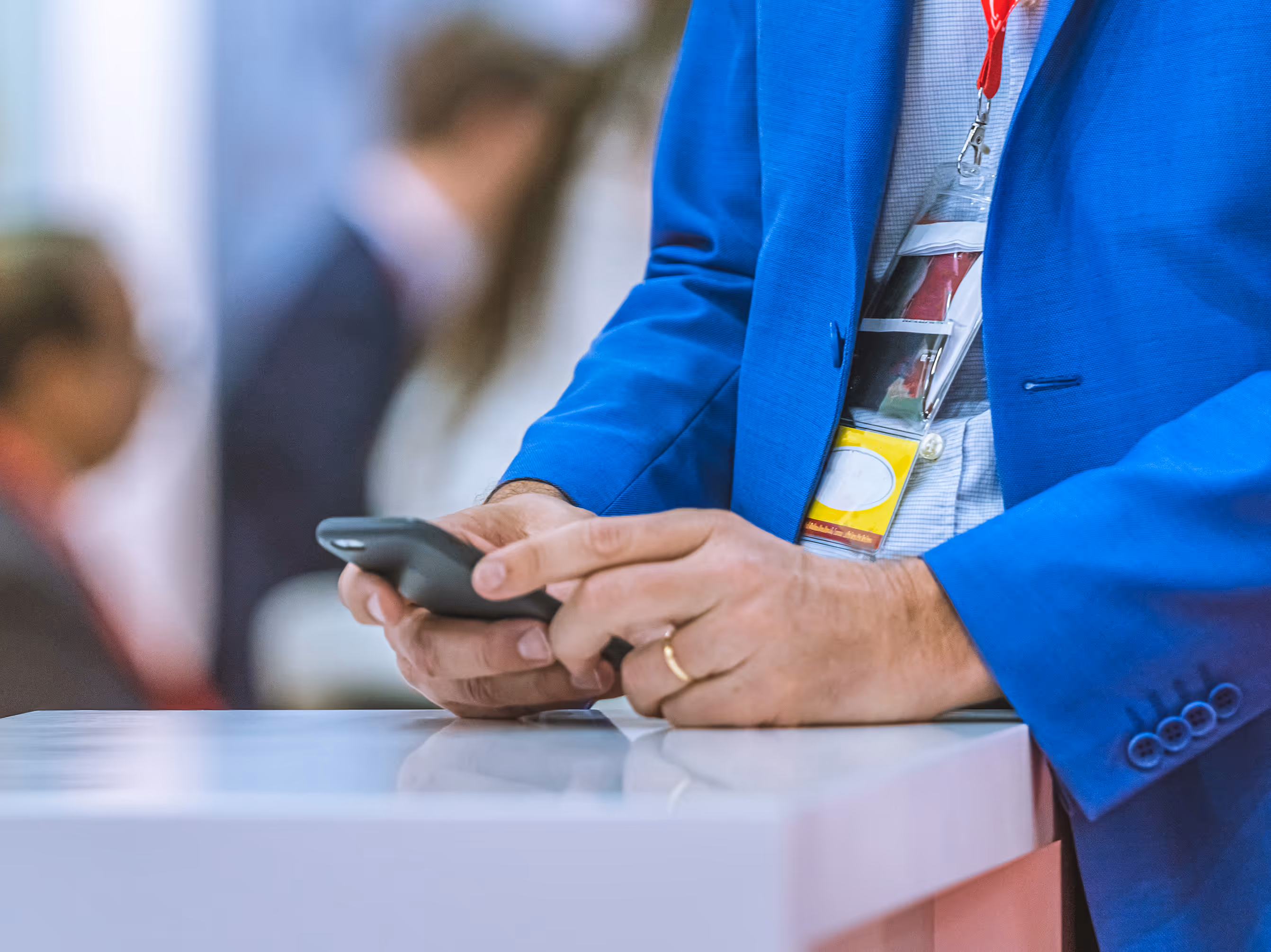 trade show exhibitor doing digital promotion on cell phone