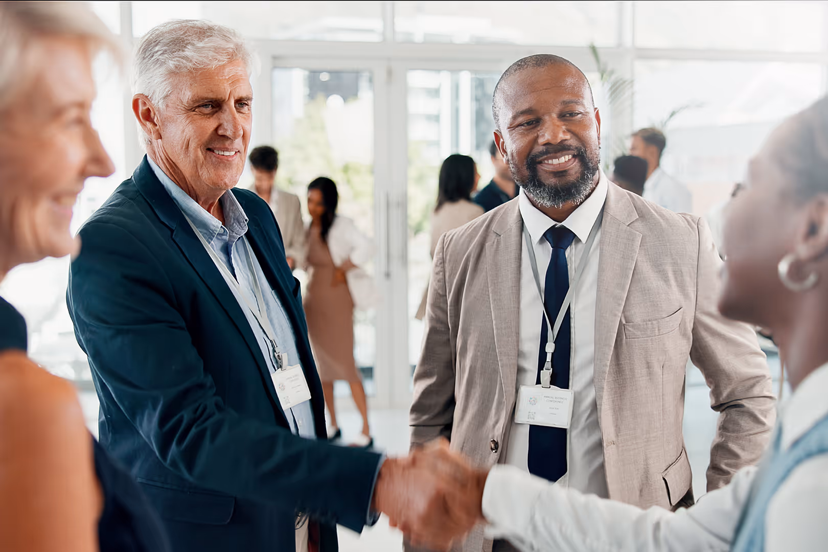 trade show exhibitors shaking hands over a deal