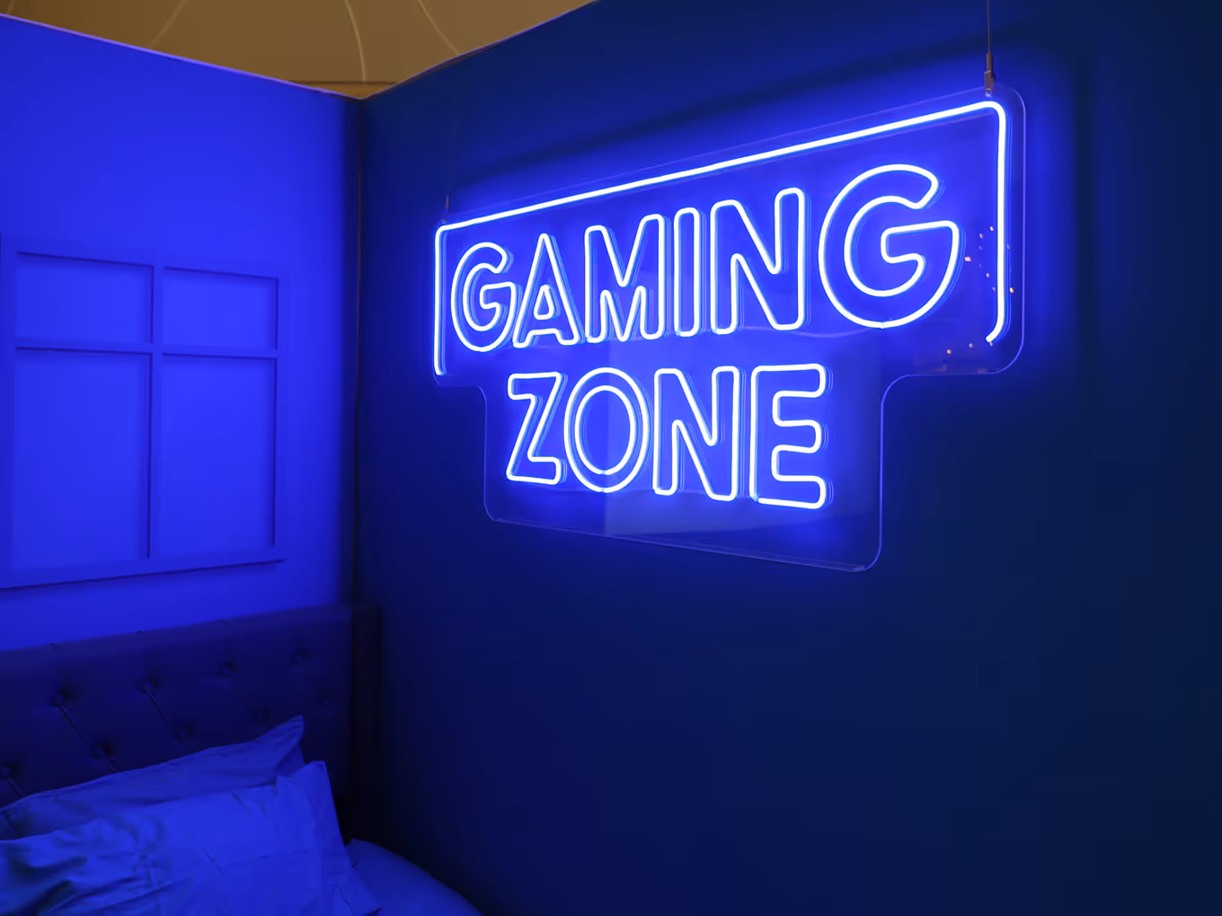 custom LED "gaming zone" sign mounted to the wall of a modular display