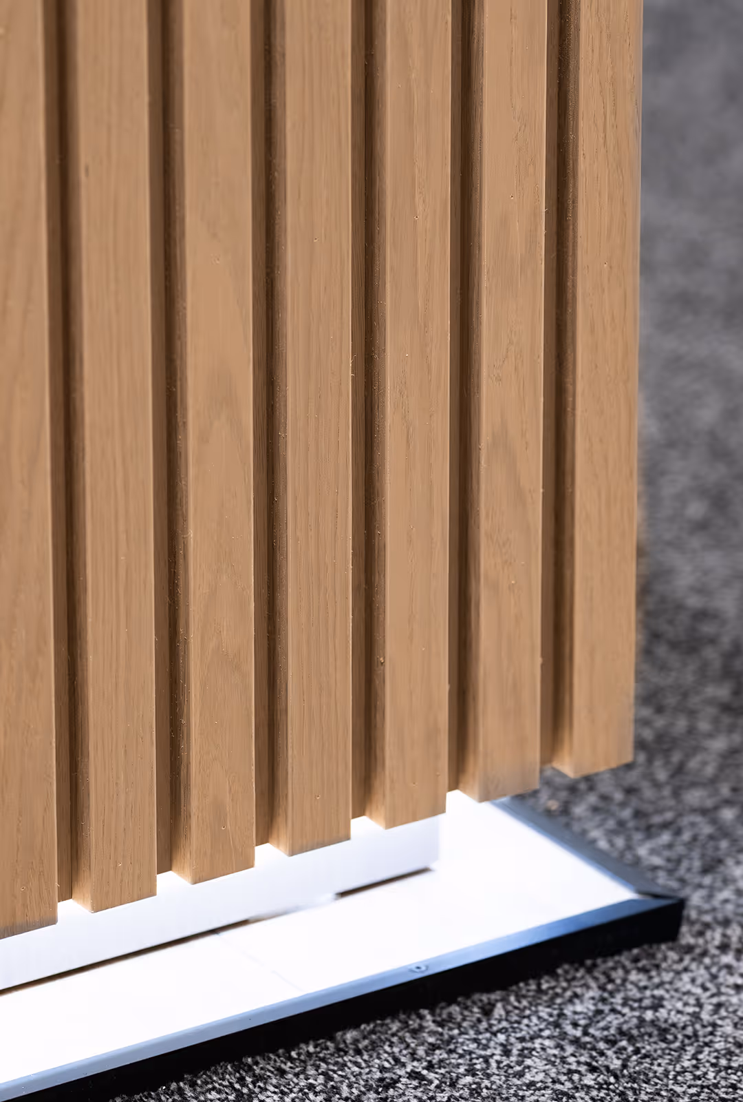 details on a custom trade show counter with wooden slats and LED base lighting