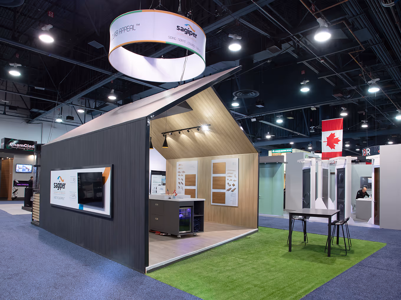 custom trade show booth with an open ended house structure and hanging fabric halo