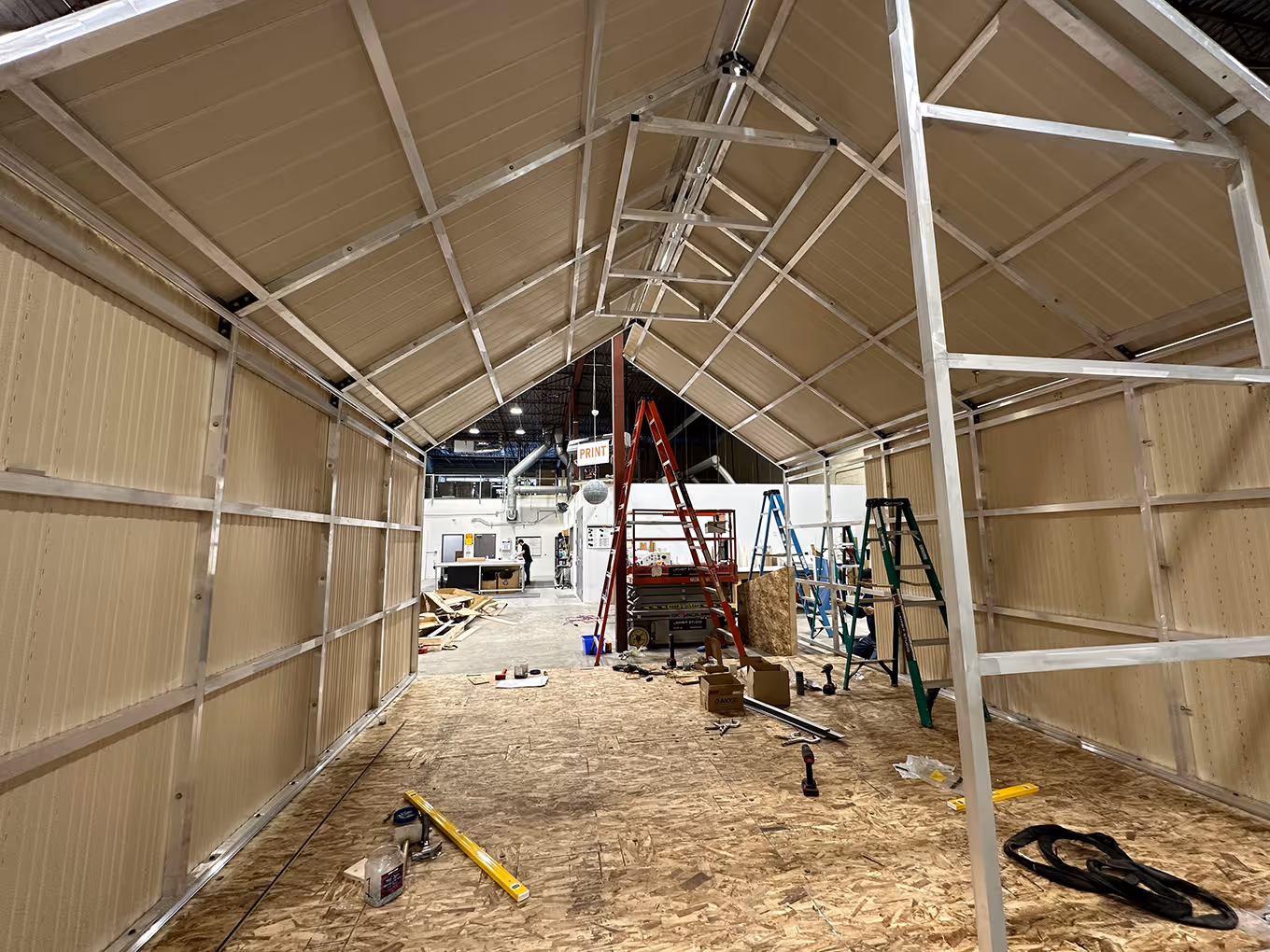 custom modular structure for a trade show display being constructed