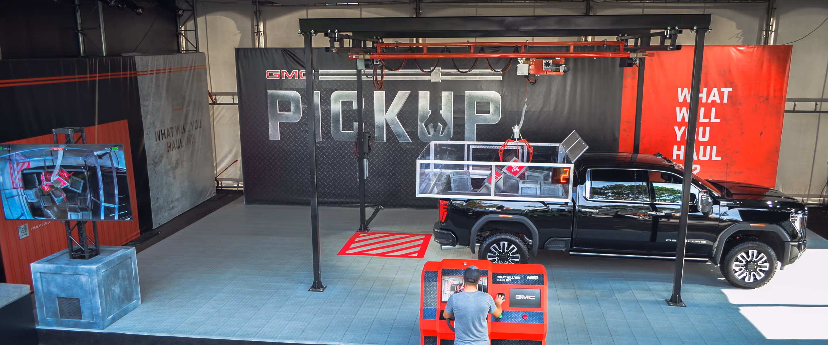giant claw machine built in the back of a pickup truck at the calgary stampede