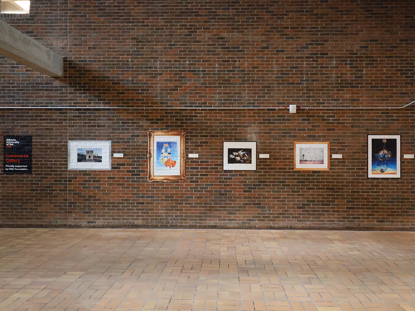 row of vinyl graphic decals that look like framed artwork applied to brick