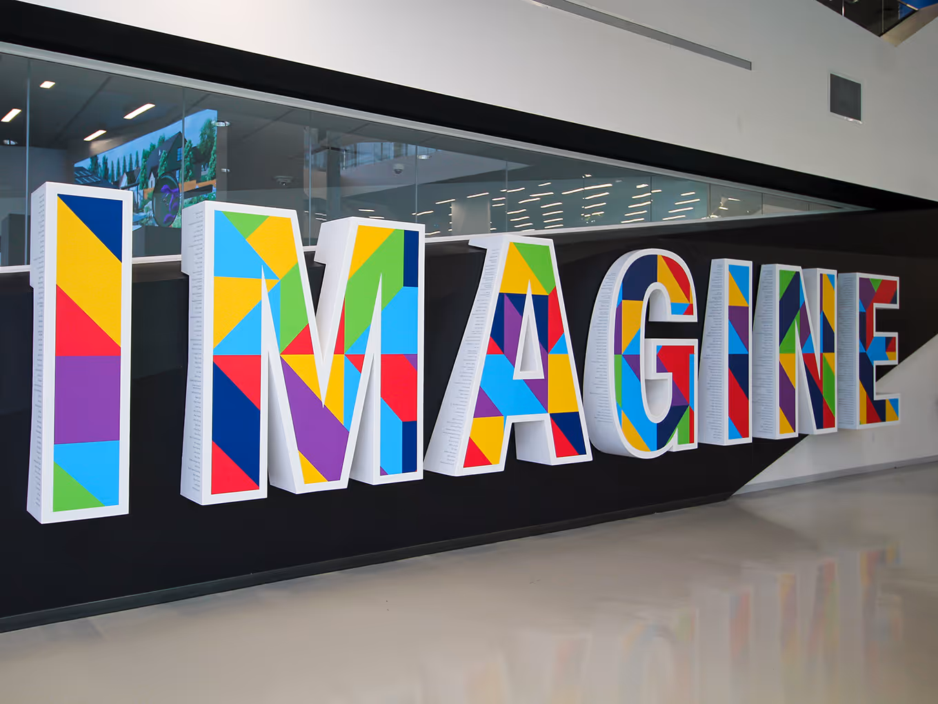 Custom built donor recognition wall with 3D letters spelling "imagine" in Edmonton