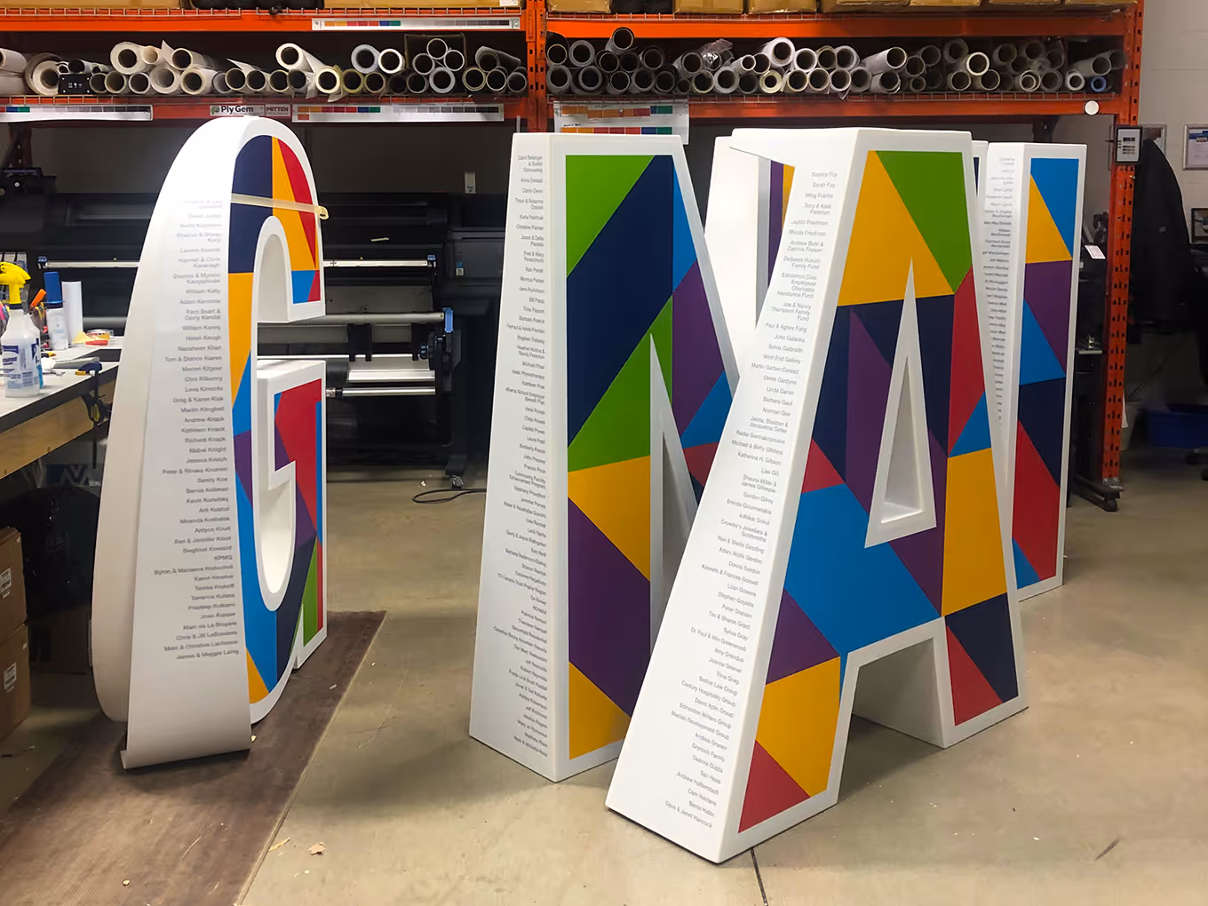series of oversized 3D letters being built in a Calgary fabrication studio