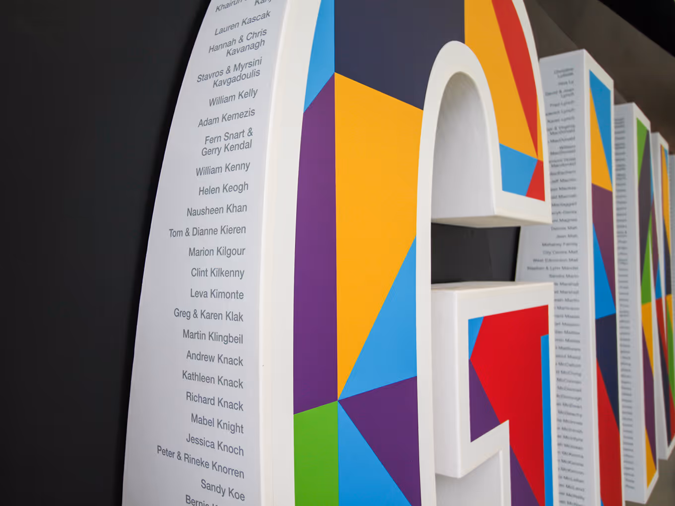 close up of a mall mounted letter "G" as part of a donor recognition monument