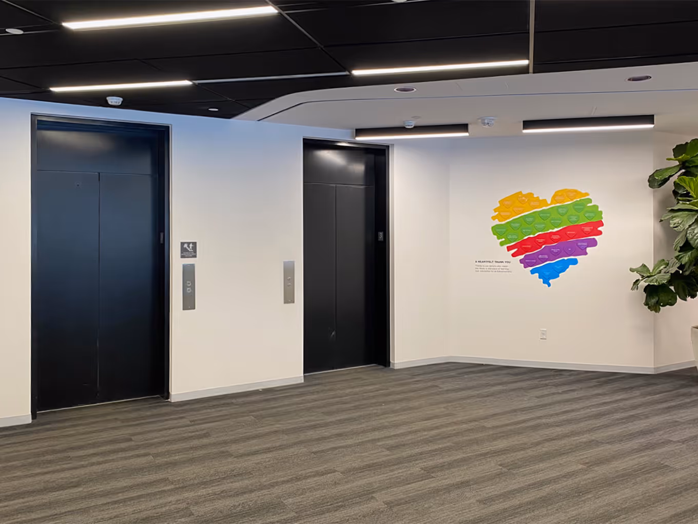 custom donor recognition wall display in a library elevator lobby