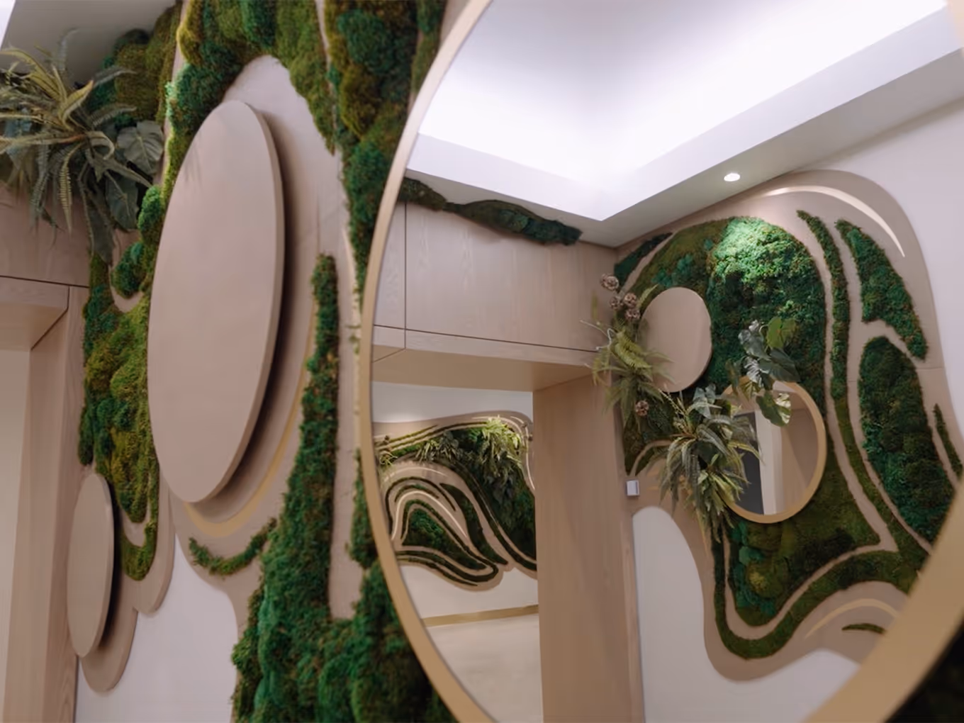 close up of a custom-built moss wall with round mirrors in a corporate space