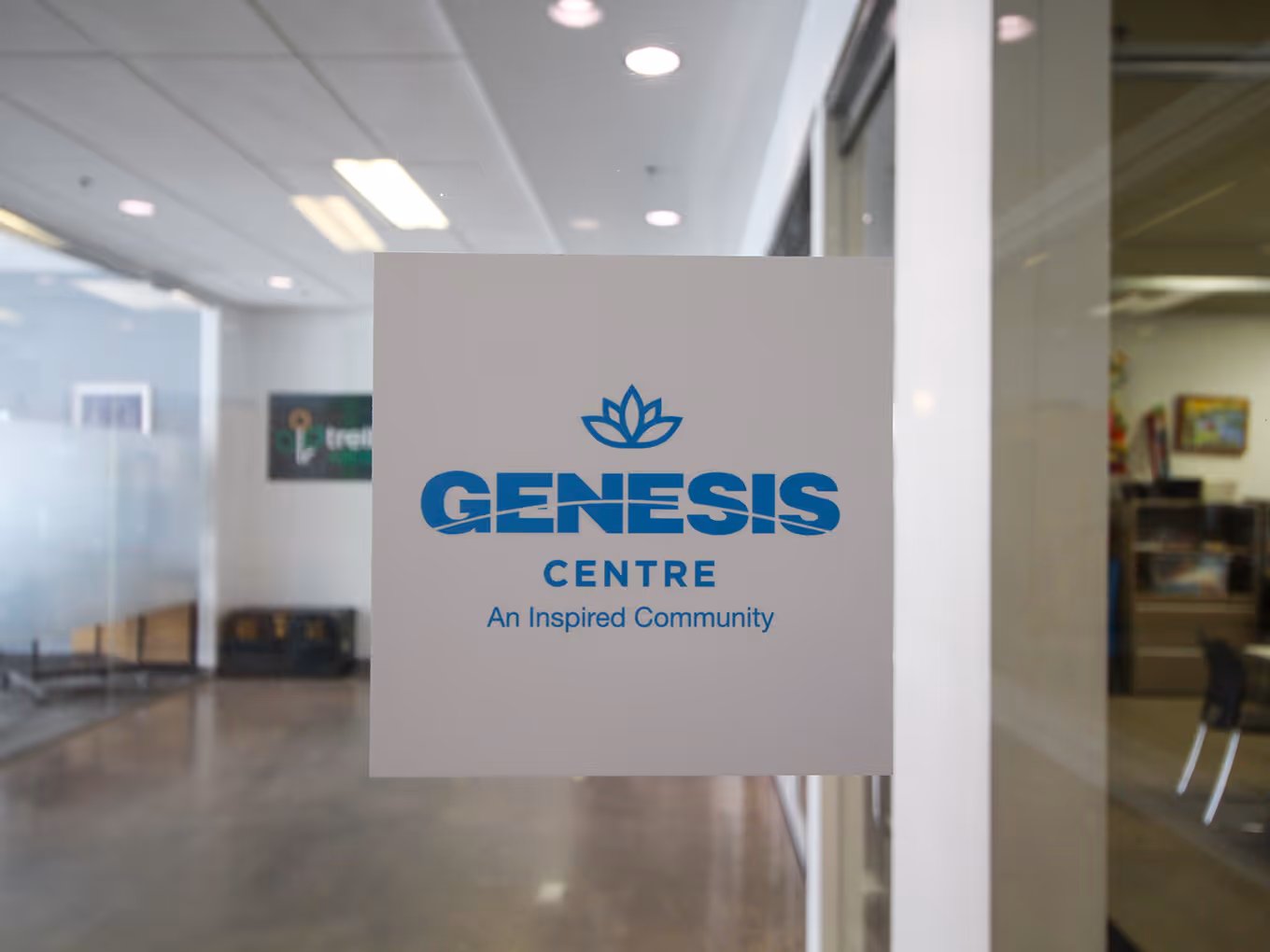 square opaque "genesis centre" window decal for an office room.