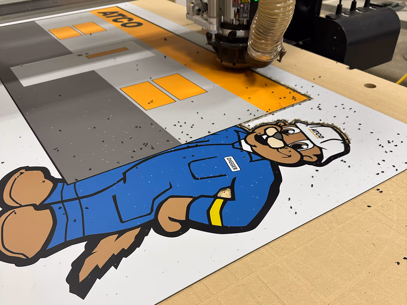 Custom Christmas display illustrated beaver character being cut out on a CNC router.