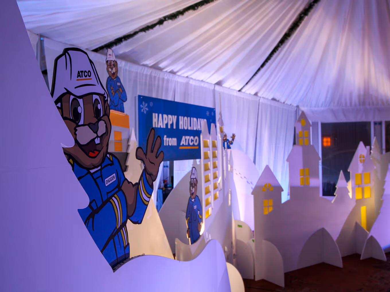 close up of an illustrated beaver character and illuminated winter backdrop scene for a custom calgary christmas display.