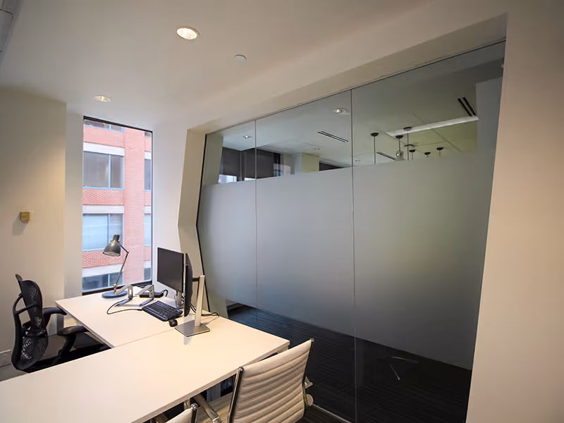 Custom frosted decal on an interior glass window, providing subtle separation between rooms.