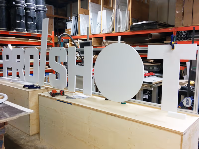 In-shop fabrication of oversized ProShot sign letters for the GMC experiential activation.