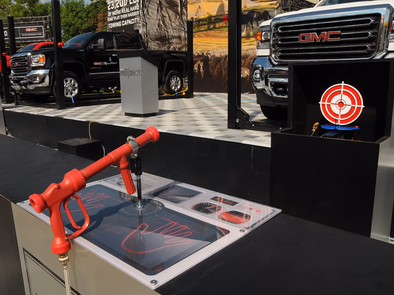 custom Water gun station and illuminated target used to raise a GMC truck in the ProShot interactive challenge.