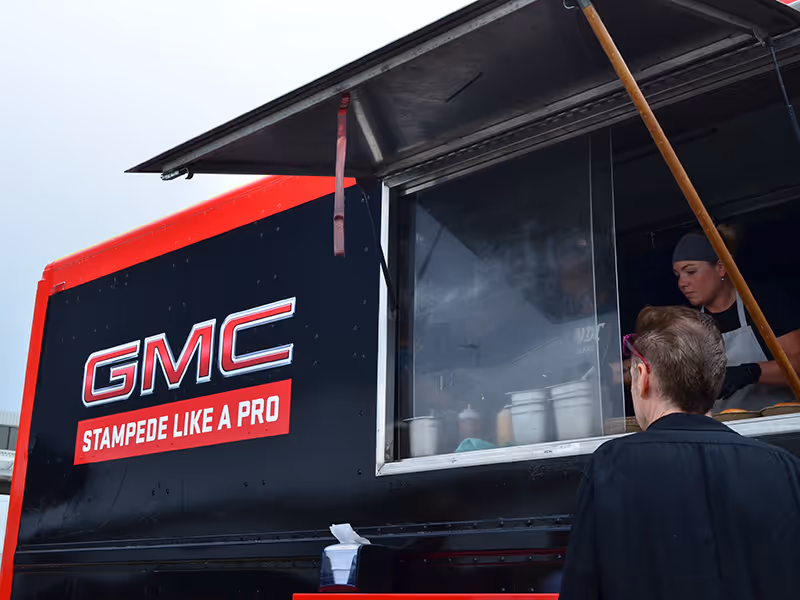 branded GMC Stampede food truck serves guests during a dealership pop-up activation.