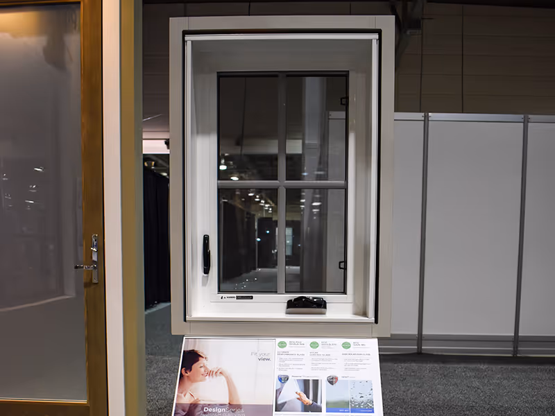 Interactive window display at the Ply Gem and Mitten trade show exhibit, allowing visitors to test window operation and explore product features hands-on.