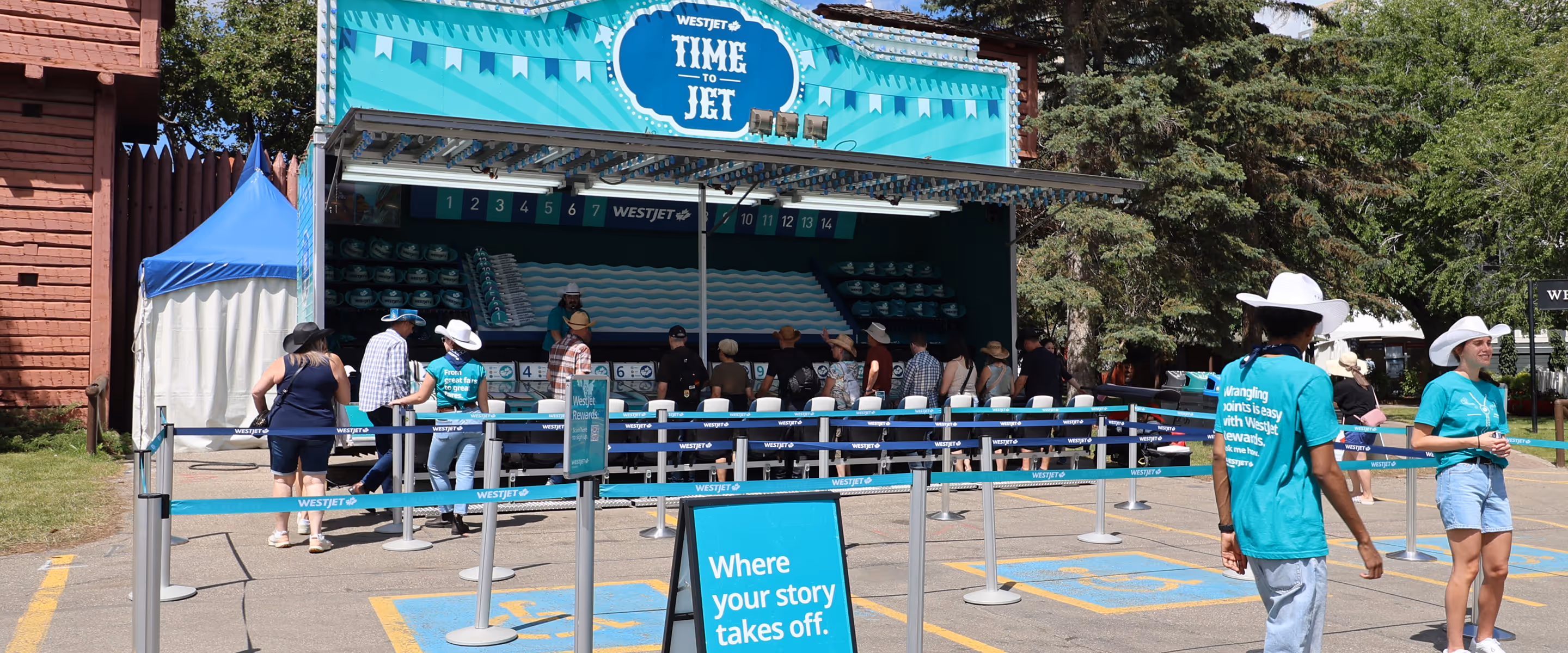 WestJet “Time to Jet” custom midway game at the Calgary Stampede featuring a branded carnival trailer, airplane-racing lanes, and guests lining up to play the activation.