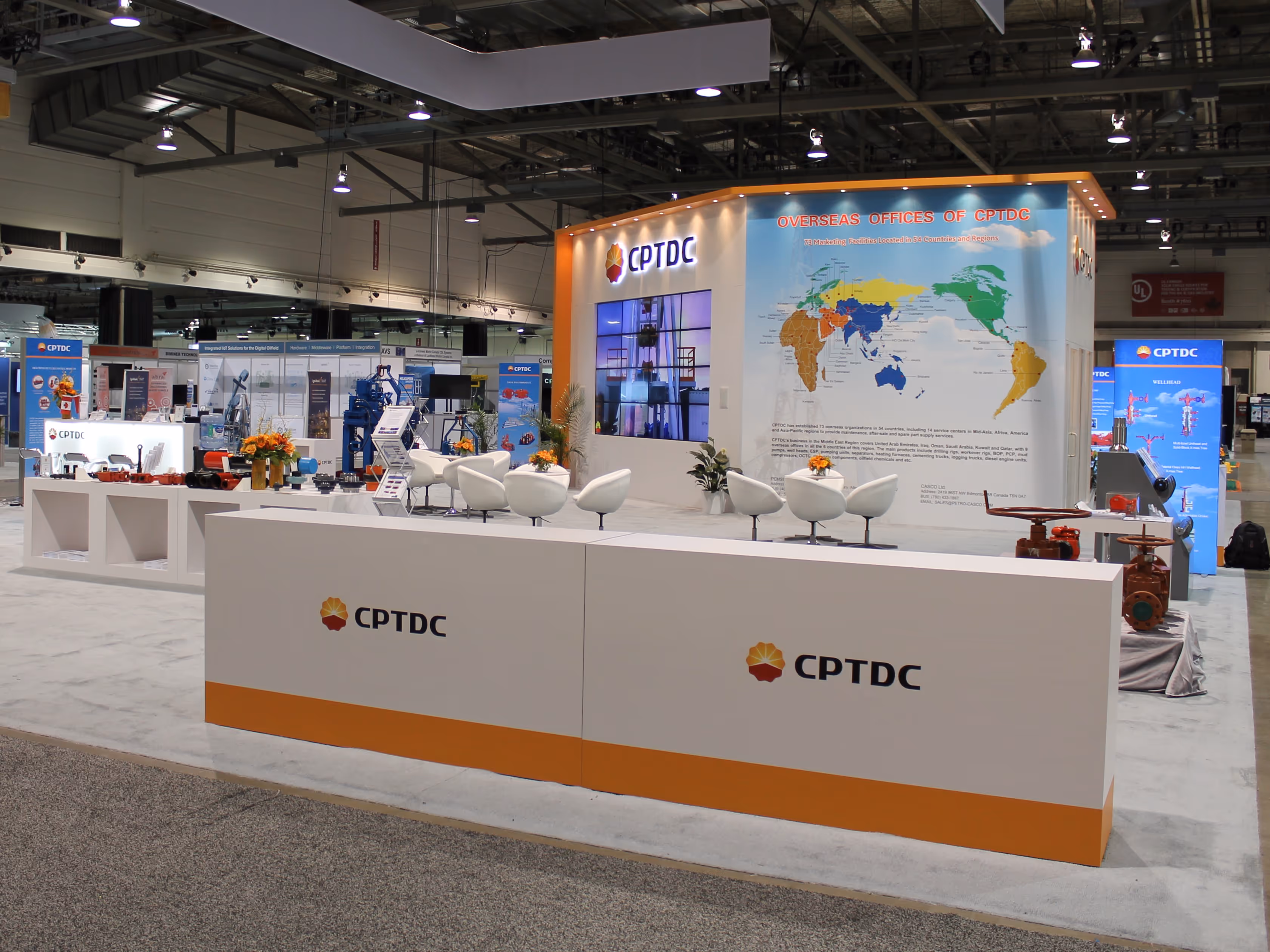 Wide-angle view of CPTDC’s 15-foot-tall custom tower structure and full exhibit layout, including product showcases, seating areas, and modular graphics built for the Global Energy Show.