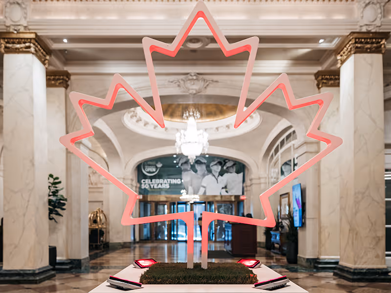 Close up of custom maple leaf event display with red LED lighting, built for the CPKC Women’s Open.