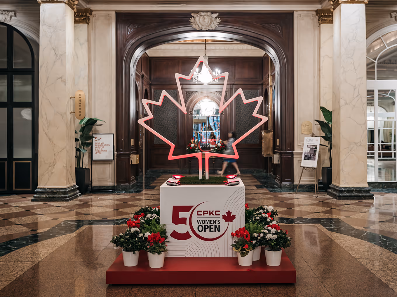 Precision-cut, illuminated maple leaf event structure designed for the CPKC Women’s Open, highlighting hidden cable management, custom graphics, and premium event fabrication.
