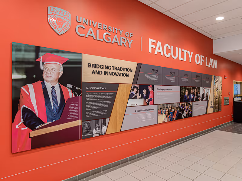 university of calgary faculty of law history wall with custom image and text panels in a geometric arrangement.