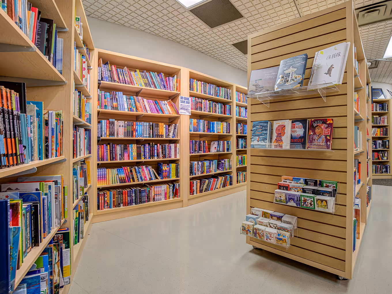 Interior view of University of Lethbridge Bookstore featuring custom shelving, mobile fixtures, and clear aisles.
