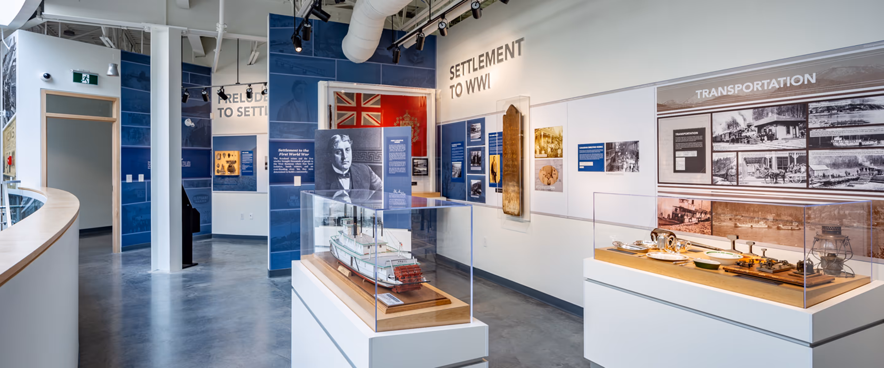 Interior of the Trail Riverfront Centre museum featuring interpretive panels, artifact display cases, and settlement history exhibits.