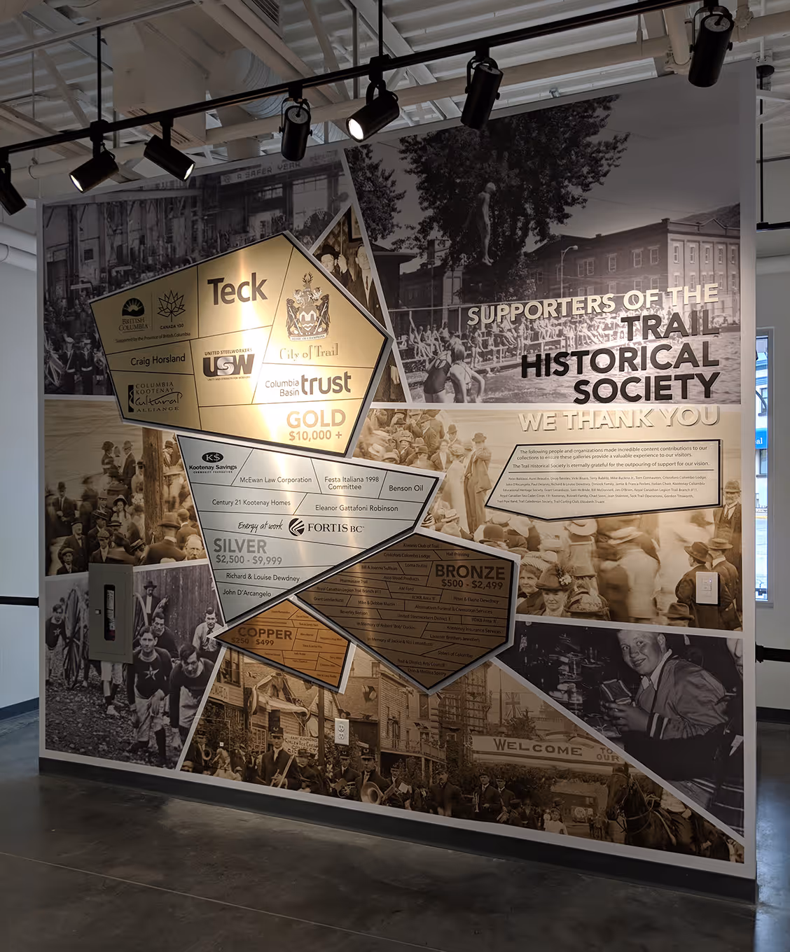 Donor recognition wall at the Trail Riverfront Centre featuring layered panels inspired by mining and community heritage.